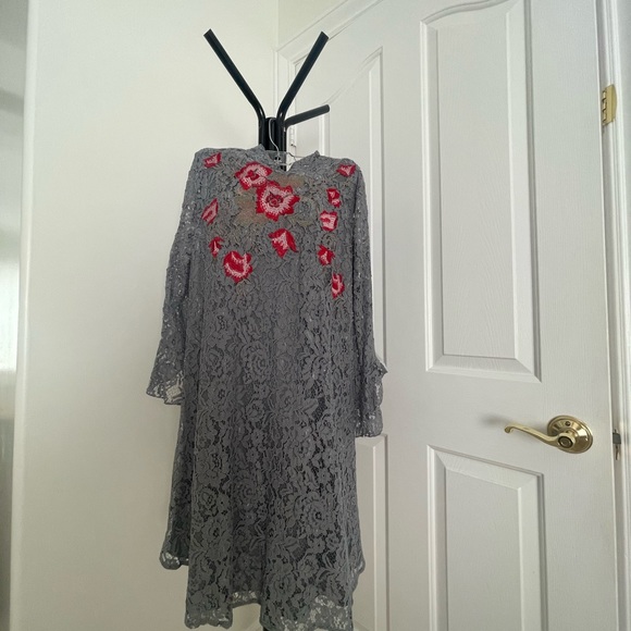 Gray lace dress with floral embroidery.